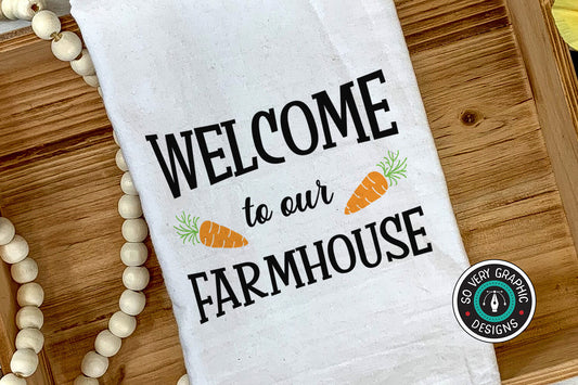 Welcome to Our Farmhouse SVG design on a tea towel