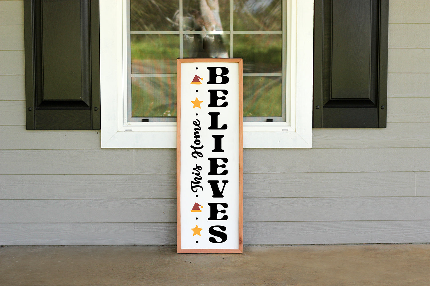 This Home Believes Farmhouse Christmas Vertical Porch Sign SVG Cut File for Cricut, Silhouette, Brother Scan N Cut machines.