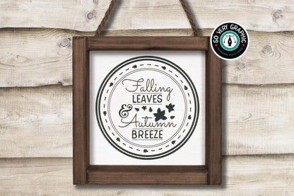 Falling Leaves & Autumn Breeze SVG Cut File from So Very Graphic in a rustic wood frame hanging from a farmhouse shiplap wall