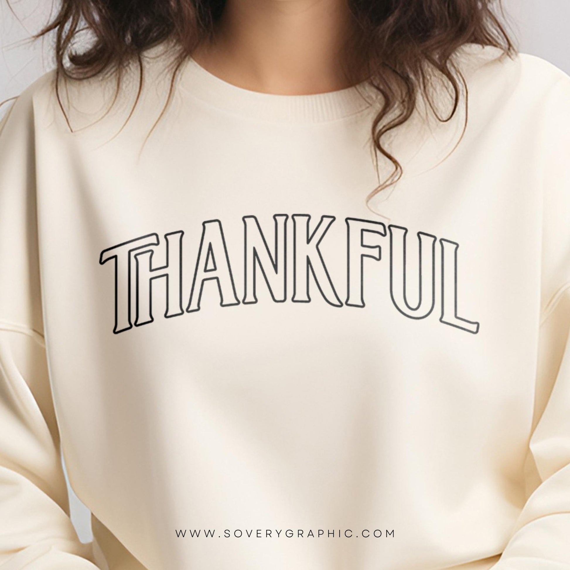 Beige sweatshirt with 'THANKFUL' text on a plain background